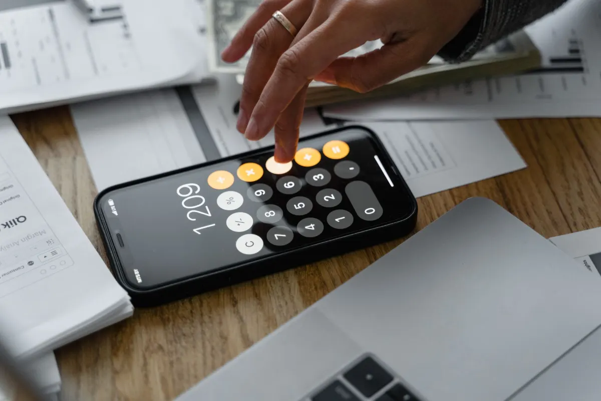 Calculator on a pile of invoices
